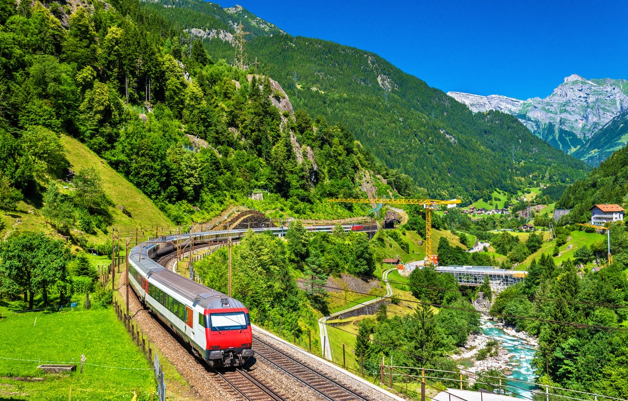 An SBB InterCity train travels through the Reuss valley on the Gotthard mountain railway